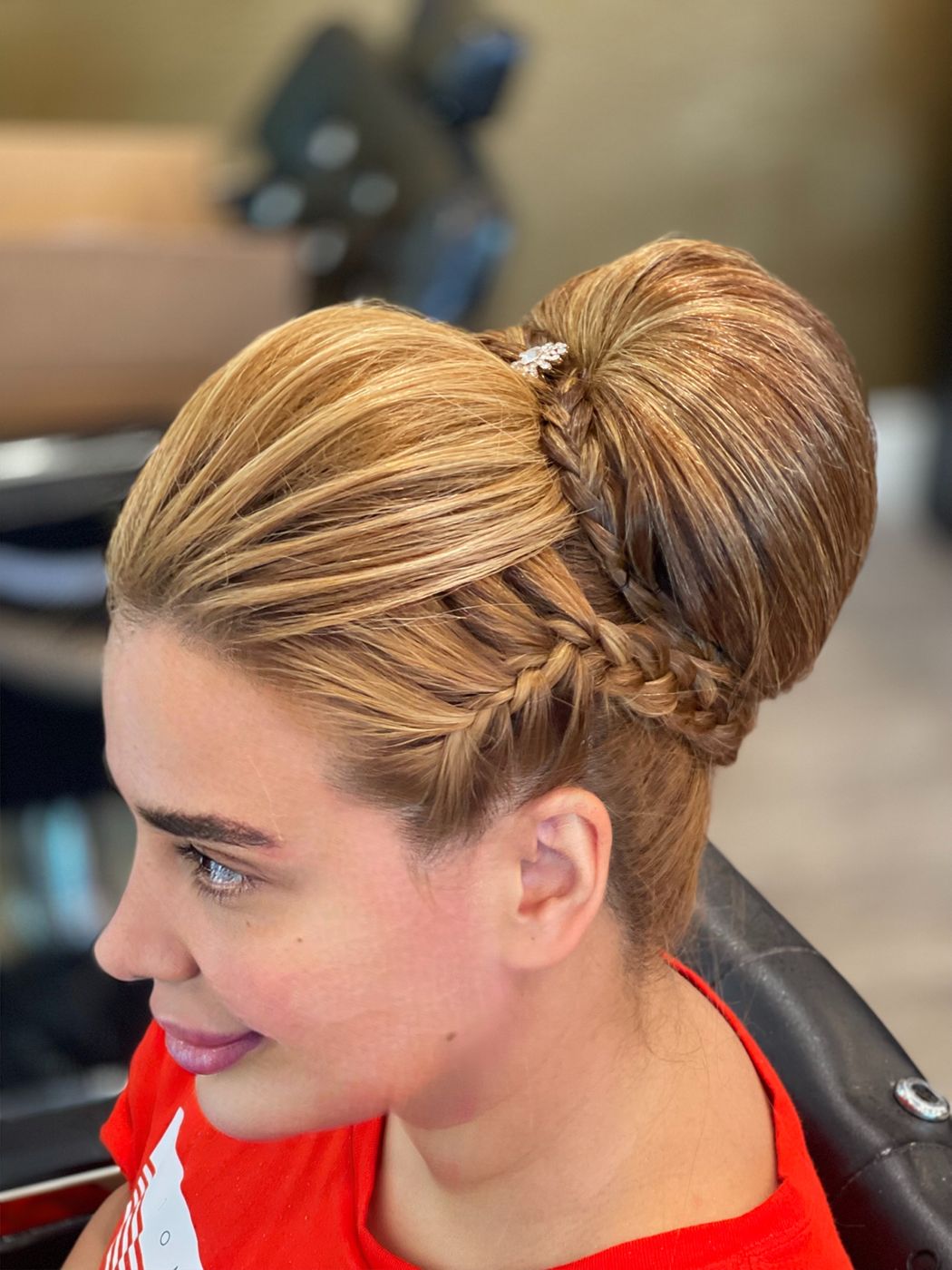 Braided high-bun updo with jeweled accent